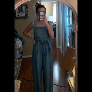 Denim looking jumpsuit. Has buttons on side size m
